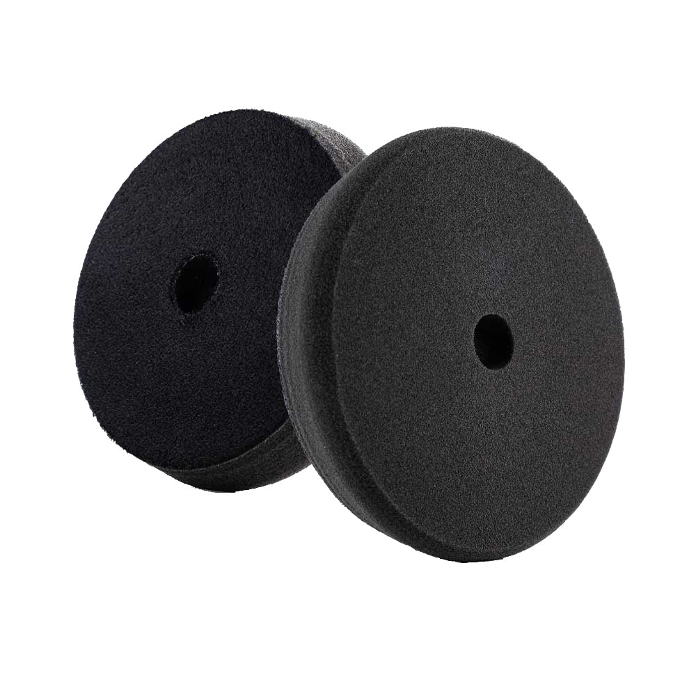 Lake Country Force Black Finishing Pad, 5.5-inch by 1.25-inch, used for car cleaning and polishing.