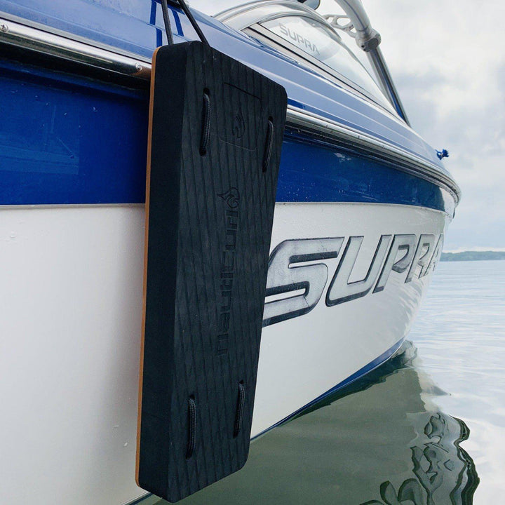 Black NautiFender flat boat fender from NautiCurl LLC, showing its modular design and durable construction for boat protection.
