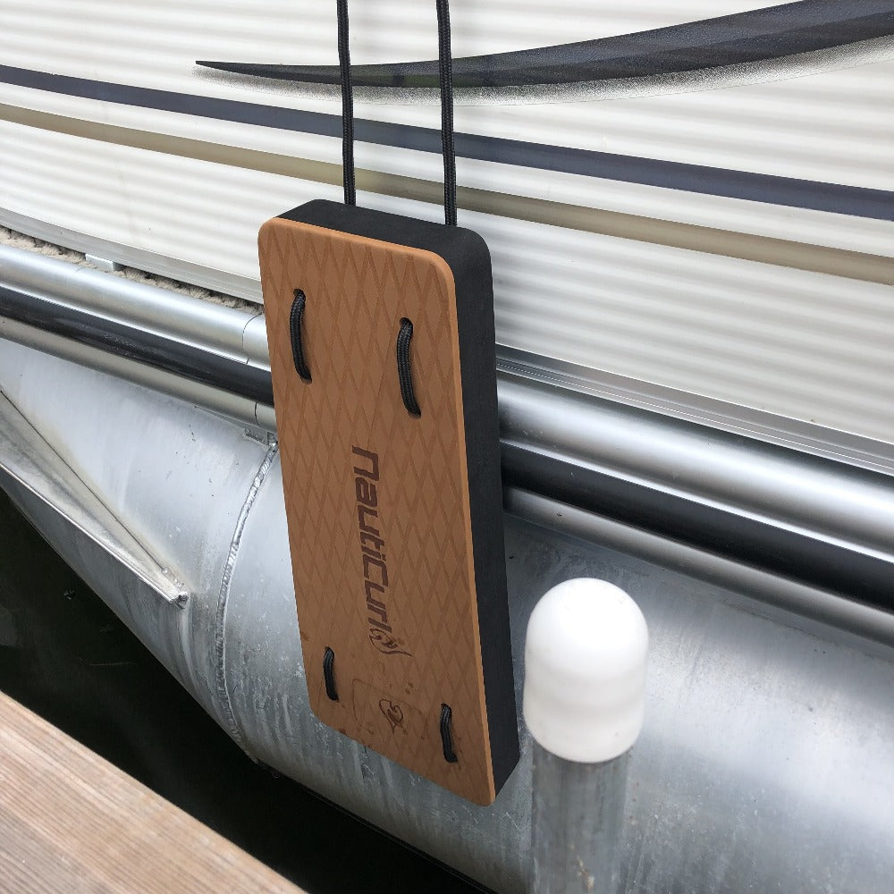 NautiFender modular flat boat fender attached to pontoon boat, showing durable design and secure mounting on the watercraft.