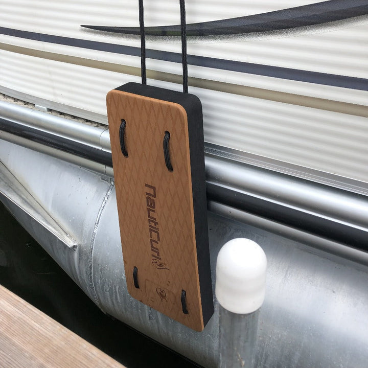 NautiFender modular flat boat fender attached to pontoon boat, showing durable design and secure mounting on the watercraft.