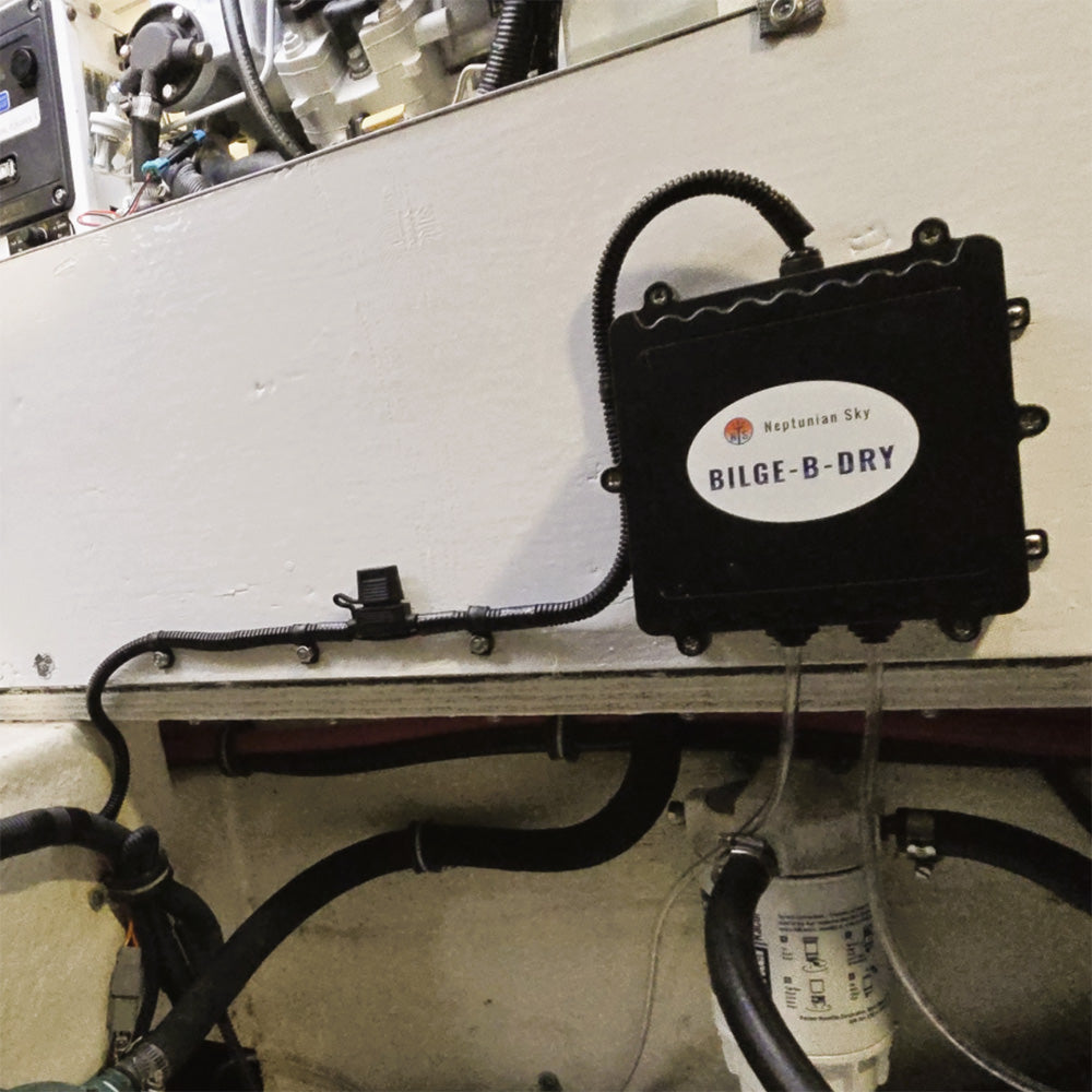 BILGE-B-DRY Quad 12VDC bilge pump showing compact design and multiple outlets for efficient water removal in boats.