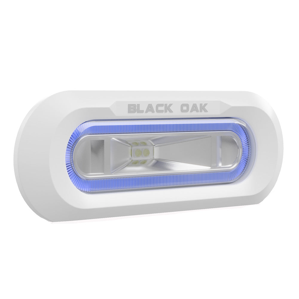 Black Oak LED underwater spreader light with white flush mount housing and blue LED, designed for marine boat lighting.