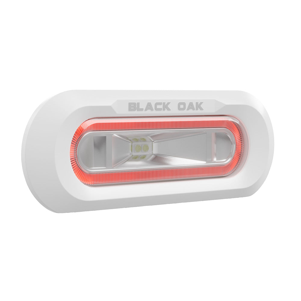 Black Oak LED low pro marine spreader light with white flush mount housing and red LED for underwater lighting.