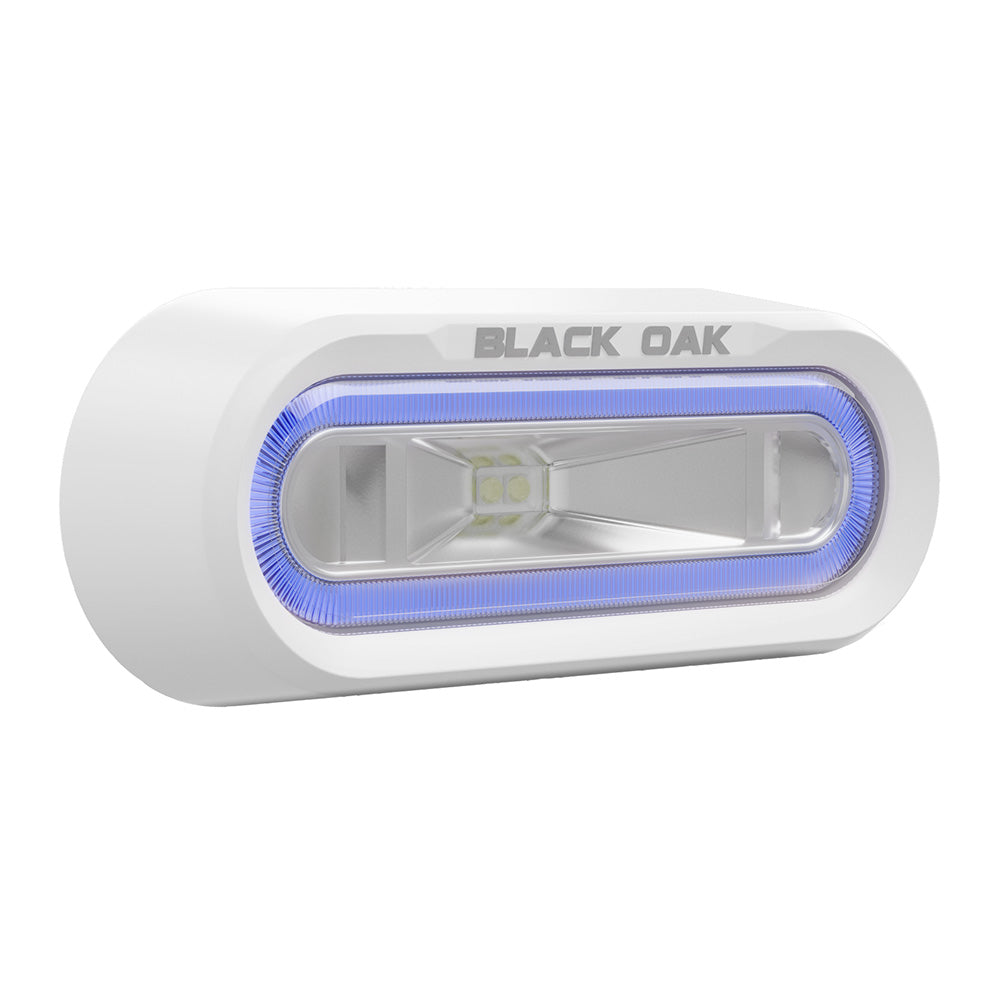 Black Oak LED Low Pro Off Road Spreader Light with white housing, blue LED, bracket mount, underwater lighting for off-road vehicles.