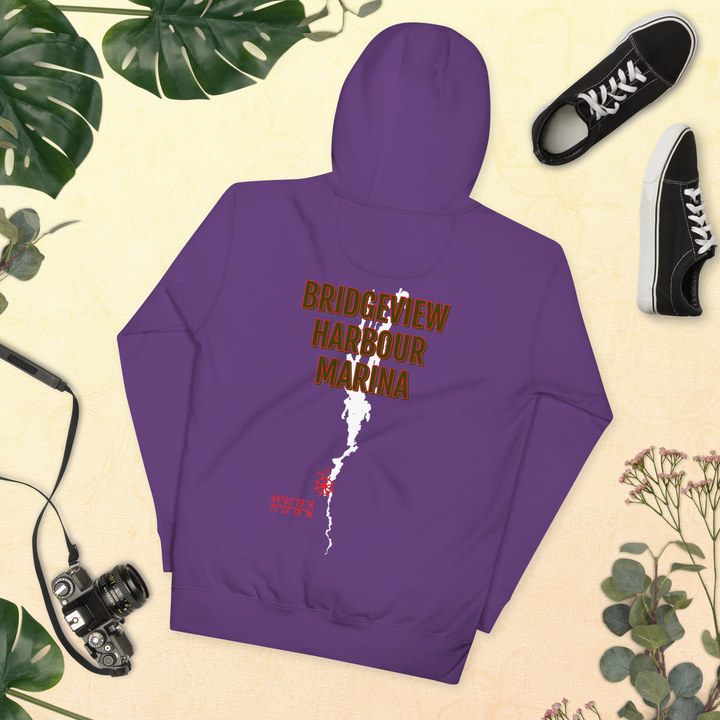 Black Bridgeview Harbour Midweight Hoodie, casual apparel with logo, displayed on a hanger.