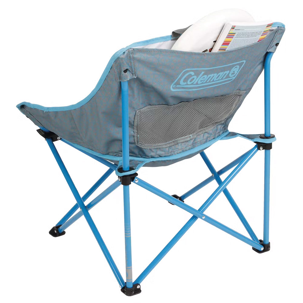 Blue Coleman Kickback Breeze camping chair with armrests and mesh back for comfortable outdoor seating.