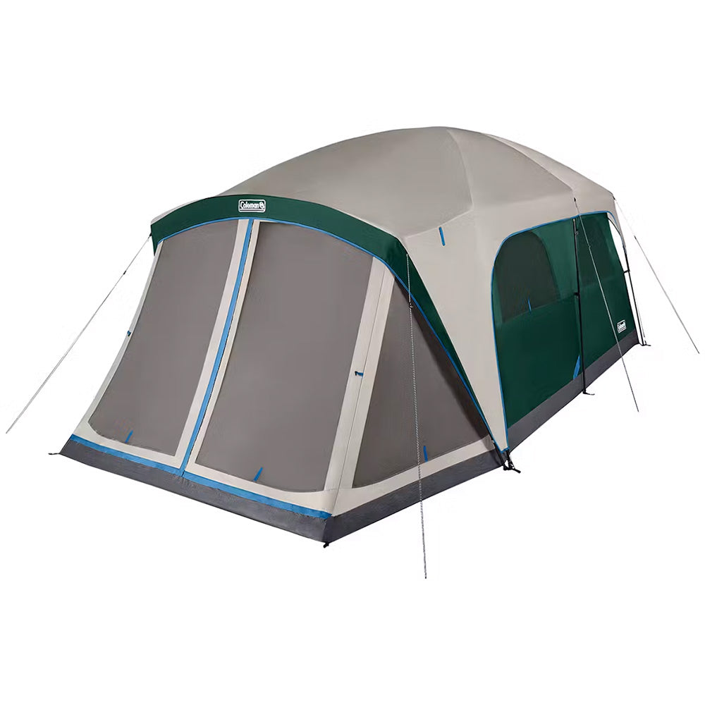 Coleman 12-Person Skydome camping tent with screen room in evergreen, set up outdoors with open door showing spacious interior