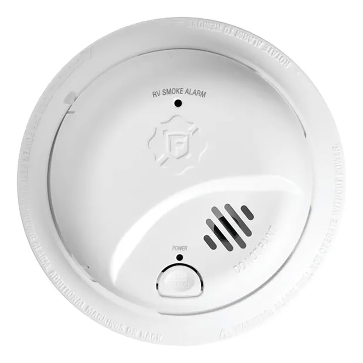 Fireboy-Xintex SMI100RV smoke detector with 9V battery, fume detector mounted on wall, safety device for residential use.