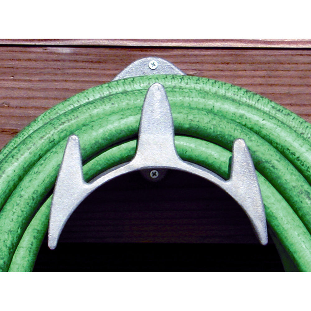 Monarch Marine cleaning hose holder mounted on a wall, durable plastic design for organized outdoor cleaning equipment