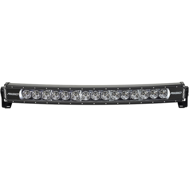 RIGID Industries Radiance + Curved 30-inch RGBW light bar mounted on vehicle, showcasing bright LED illumination and sleek design.
