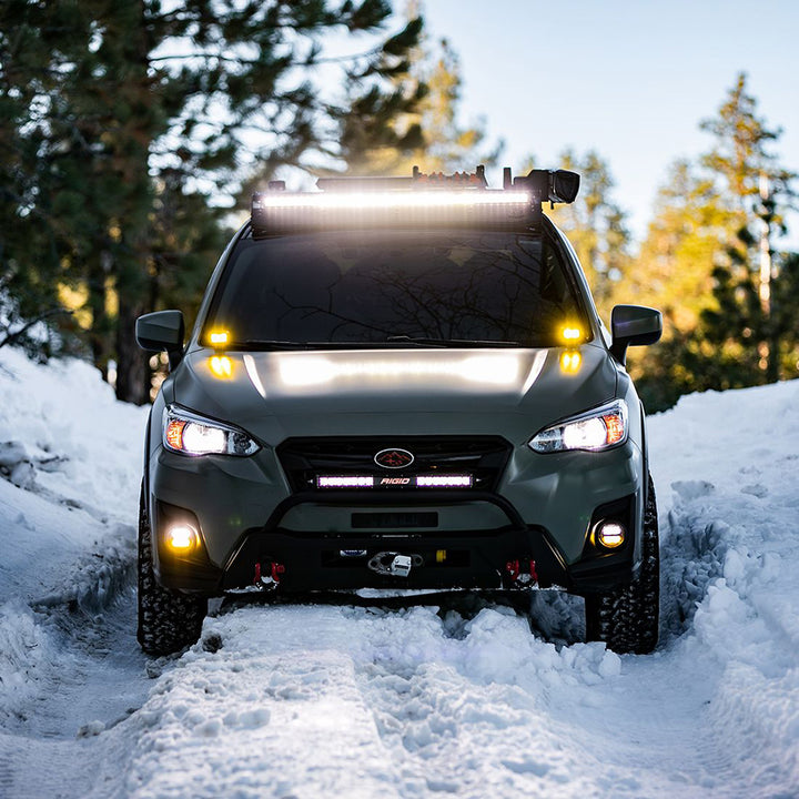 Pair of RIGID Industries 360-Series 4" LED SAE fog beam lights in yellow and white, designed for vehicle fog lighting.