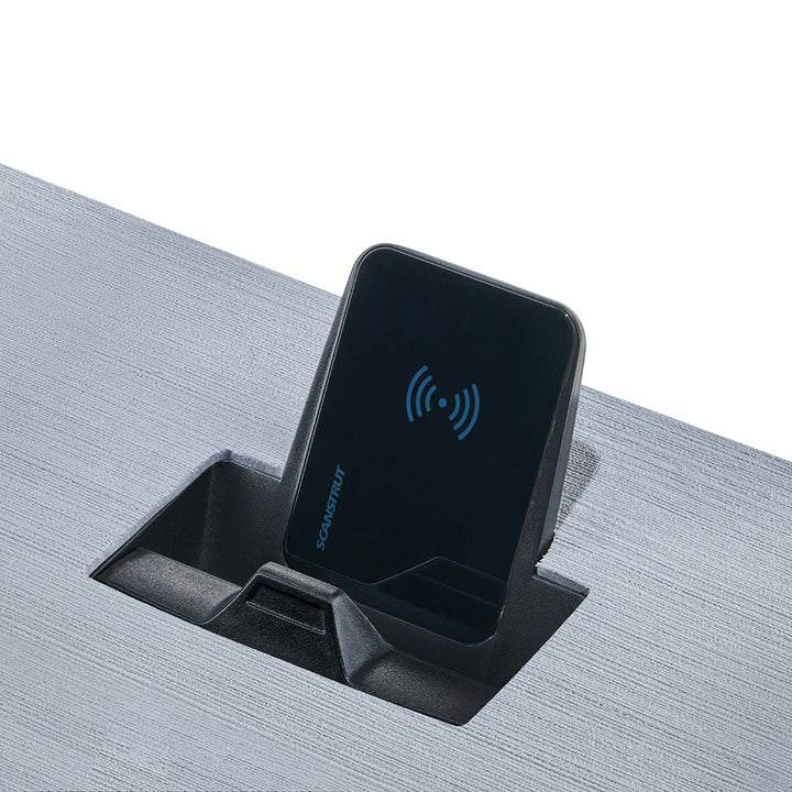 Scanstrut Aura magnetic wireless charger with 10W power, 12/24V compatible, shown as a sleek metallic accessory for charging devices.