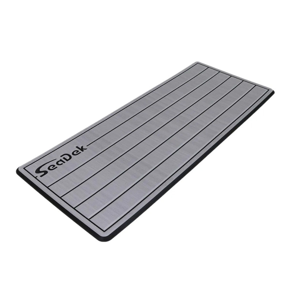 SeaDek 16x39" dual-density large Teak helm pad with SeaDek logo, brushed Storm Gray and Black textured surface, for deck or galley.