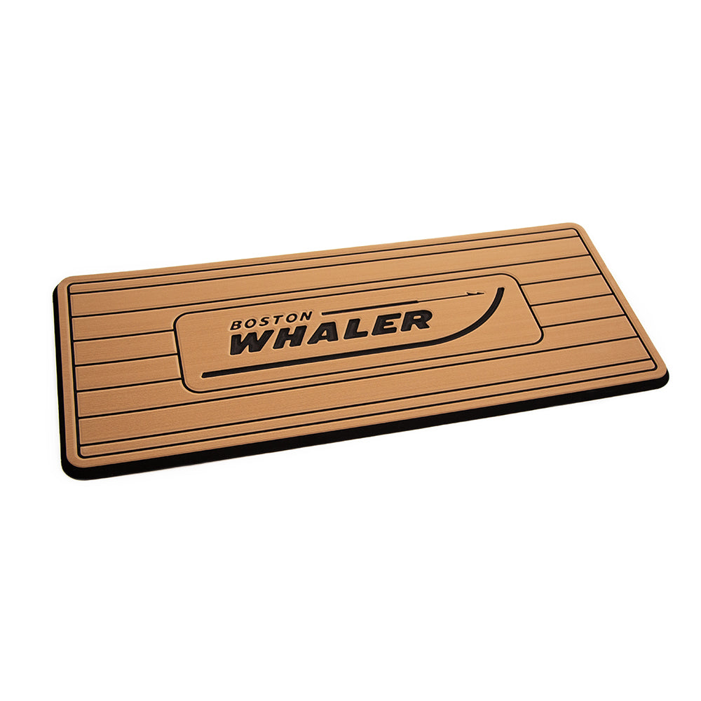 SeaDek Boston Whaler helm pad in mocha and black brushed finish with routed teak lines for deck or galley use.
