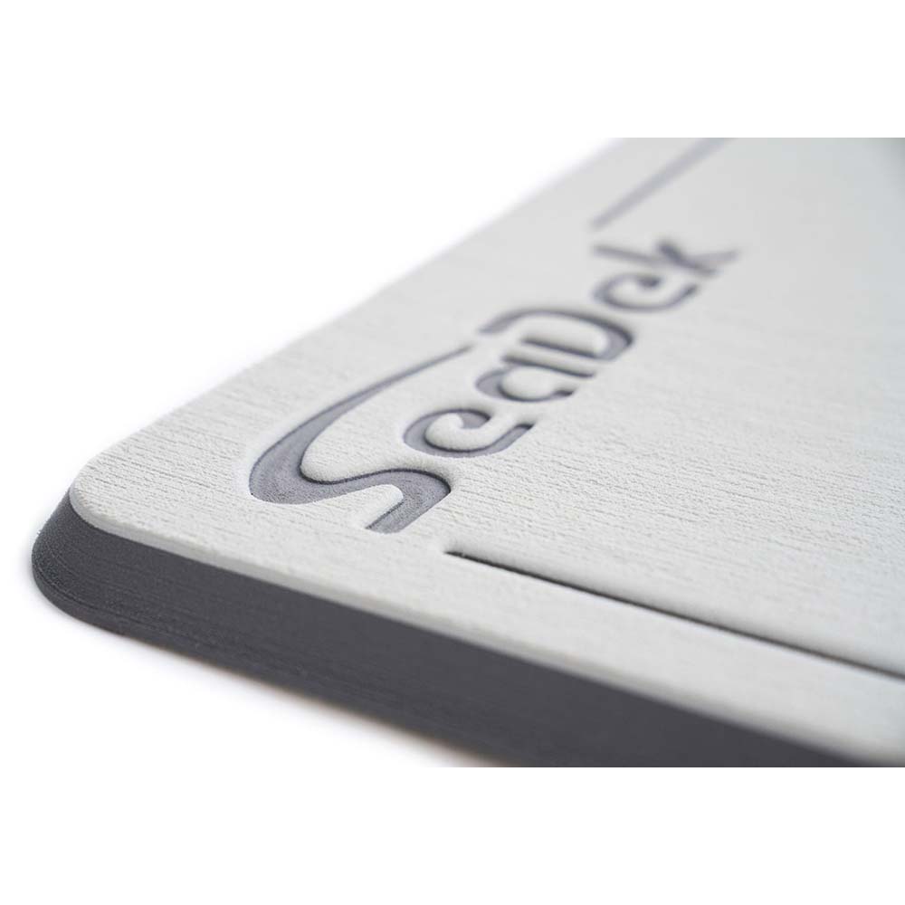 SeaDek Small Helm Pad in Cool Grey and Storm Grey for boat deck or galley, made by SeaDek, shown on a boat surface.