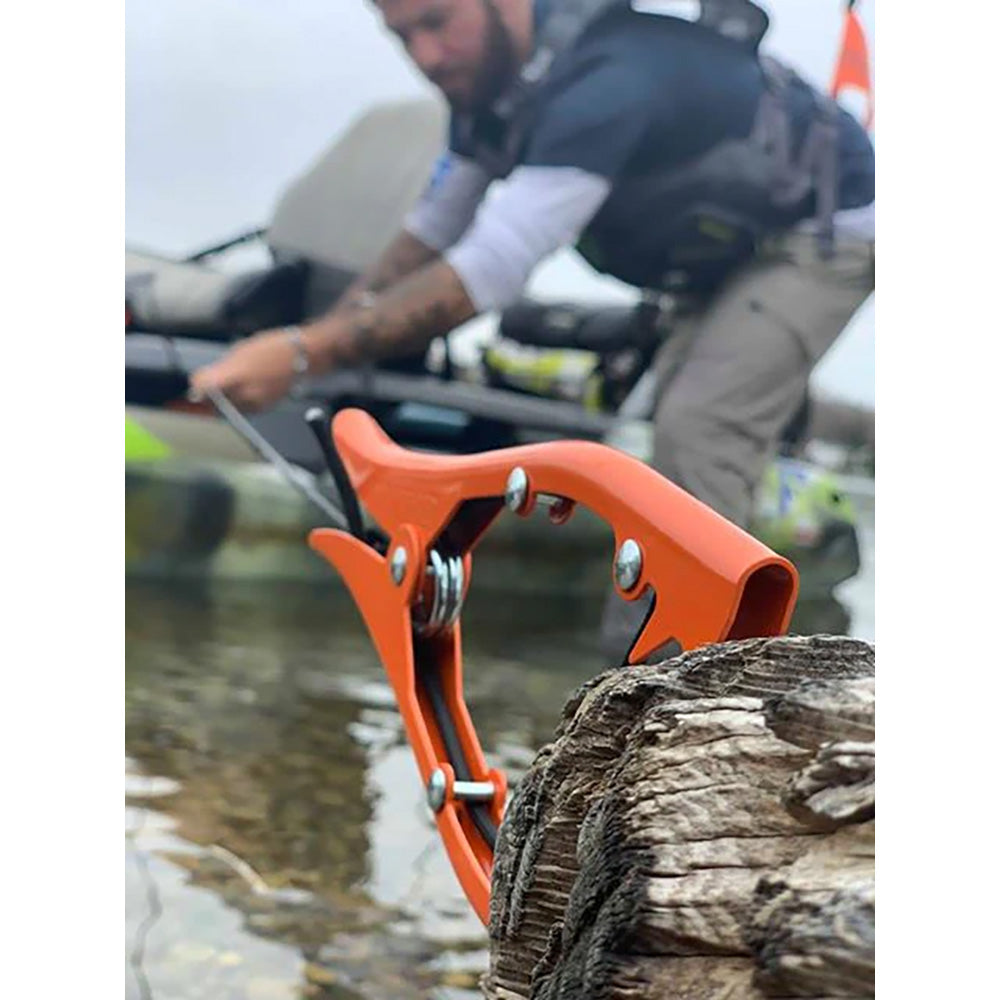 Orange YakGear Brush Gripper anchoring device for boats, designed for secure and reliable anchoring on watercraft.