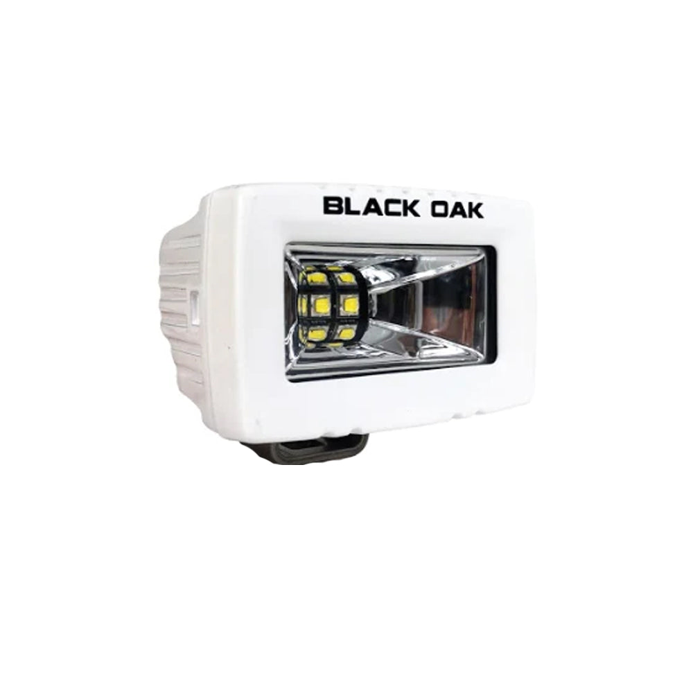 Black Oak LED 2-inch marine spreader light with white housing, Scene Optics floodlight, part of the Pro Series 3.0.