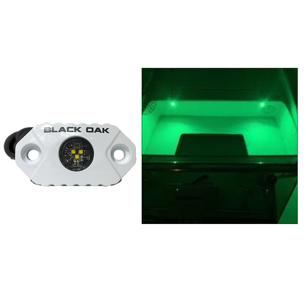 Black Oak LED interior courtesy light with green LEDs and white housing, designed as a stylish accent light for vehicle interiors.