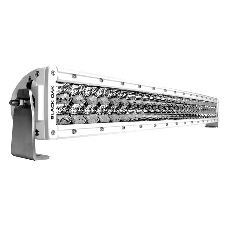 Black Oak LED Pro Series 3.0 curved double row 30-inch LED light bar with combo optics and white housing for vehicle lighting.