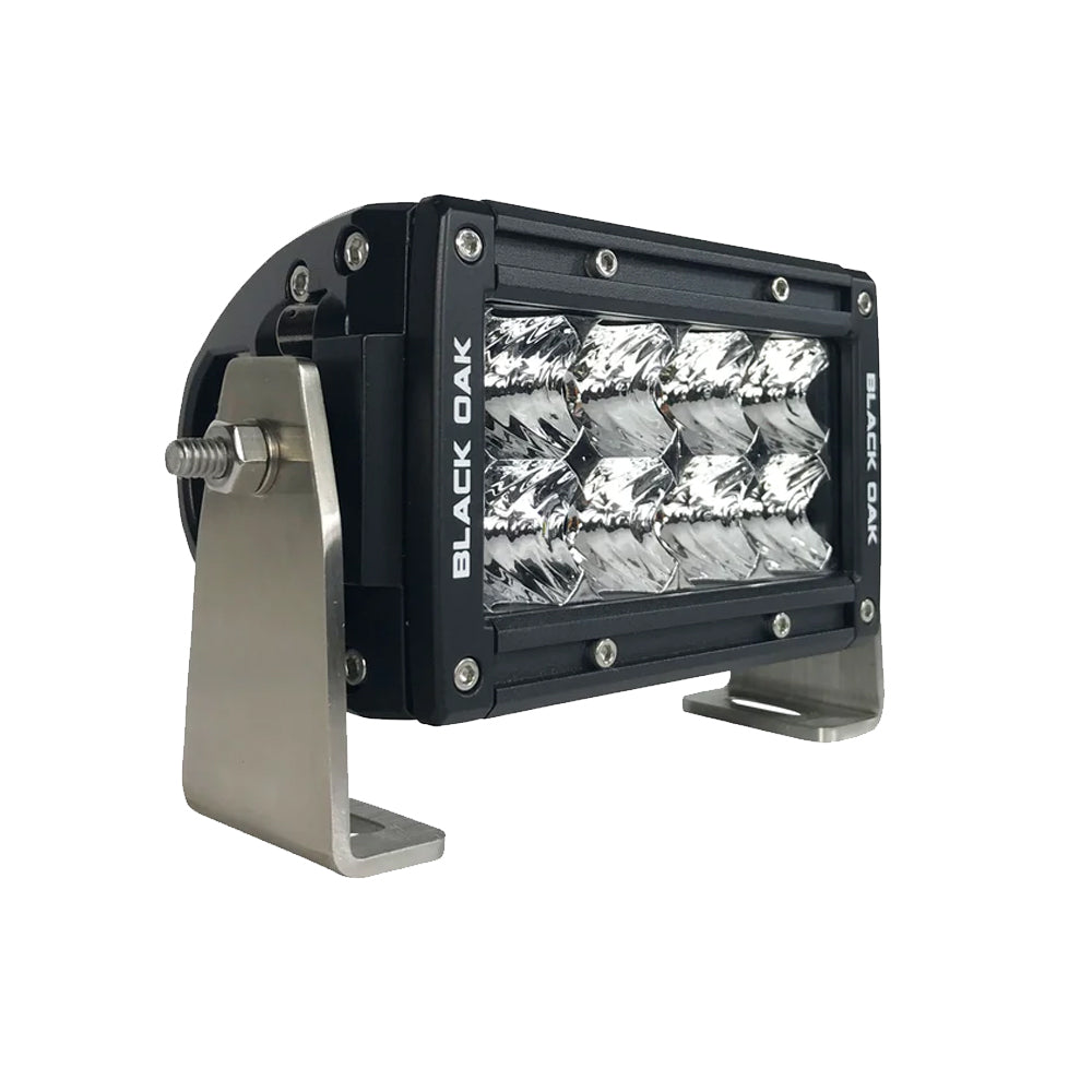Black Oak LED Pro Series 3.0 double row 4-inch LED light bar with flood optics and black housing, designed for off-road lighting.