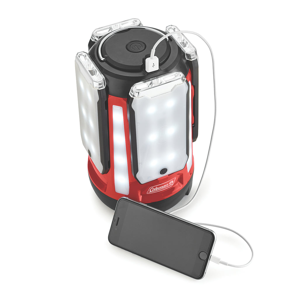 Coleman Quad Pro 800L LED Panel Lantern showing four-panel design with bright illumination and sturdy handle for outdoor lighting.