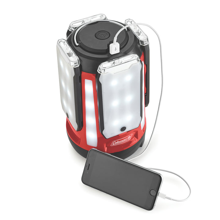 Coleman Quad Pro 800L LED Panel Lantern showing four-panel design with bright illumination and sturdy handle for outdoor lighting.