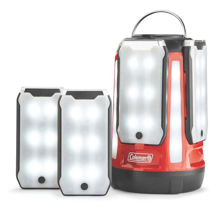 Coleman Quad Pro 800L LED Panel Lantern providing bright, even lighting with four adjustable panels for outdoor camping or emergency use.