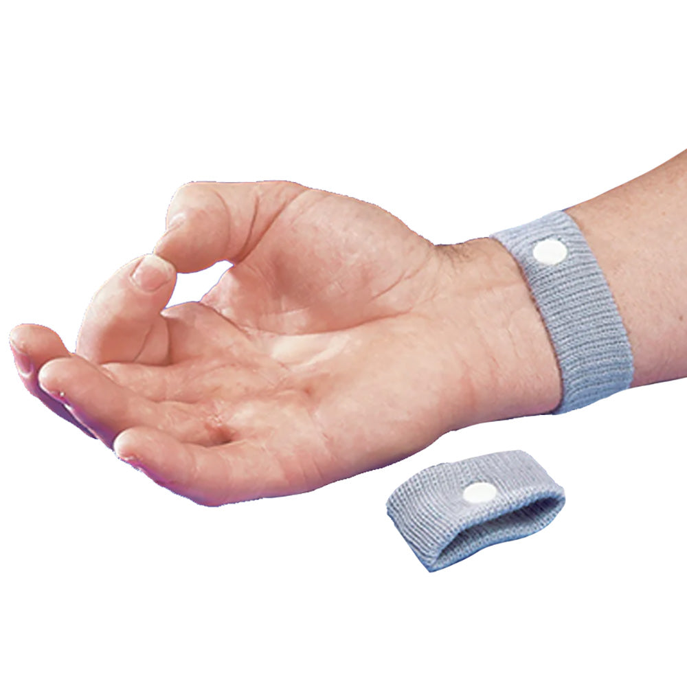 Pair of Davis Instruments Queaz-Away motion sickness wristbands, soft fabric accessories for nausea relief.