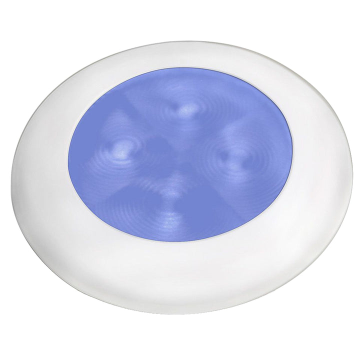 Hella Marine Slim Line LED round courtesy lamp with blue LED, white plastic bezel, for interior use, 12V power supply.