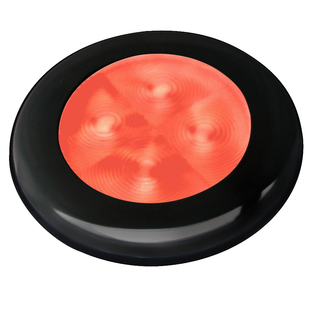 Hella Marine Slim Line LED round courtesy lamp with red LED, black plastic bezel, for interior use, 12V power supply.