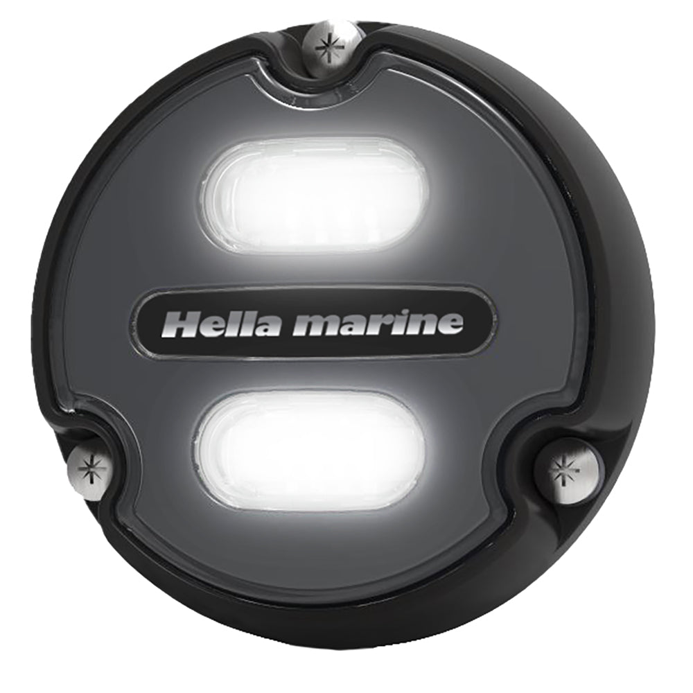 Hella Marine Apelo A1 underwater light with black housing and charcoal lens, emitting blue-white light, 1800 lumens, for marine use.