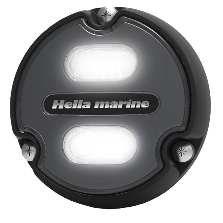 Hella Marine Apelo A1 underwater light with black housing and charcoal lens, emitting blue-white light, 1800 lumens, for marine use.