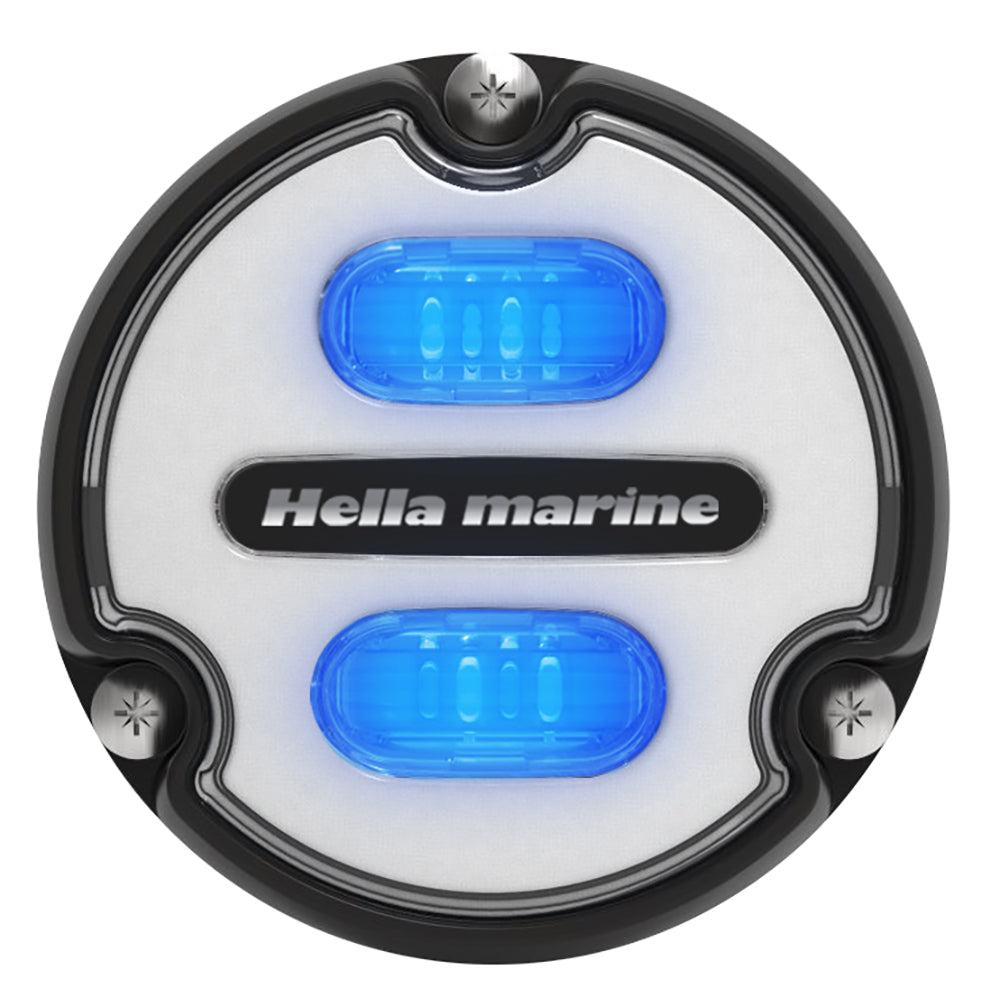 Hella Marine Apelo A1 underwater light with black housing and white lens, emitting blue and white light, 1800 lumens.