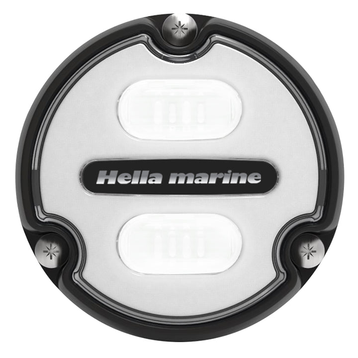 Hella Marine Apelo A1 underwater light with black housing and white lens, emitting 1800 lumens in blue-white color.