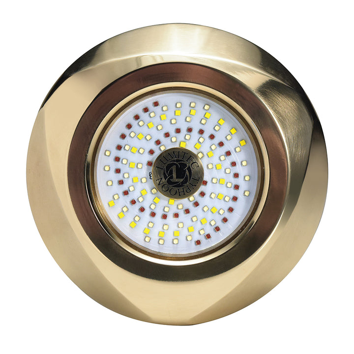 Lumitec SeaBlaze Typhoon underwater bronze thru-hull LED light in white and blue, mounted on a boat hull.