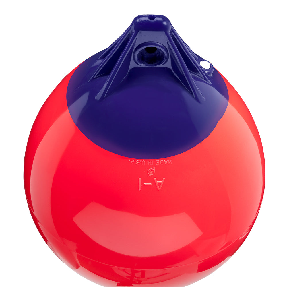 Red Polyform A-1 buoy with 11-inch diameter, made by Polyform U.S., floating on water for maritime safety.