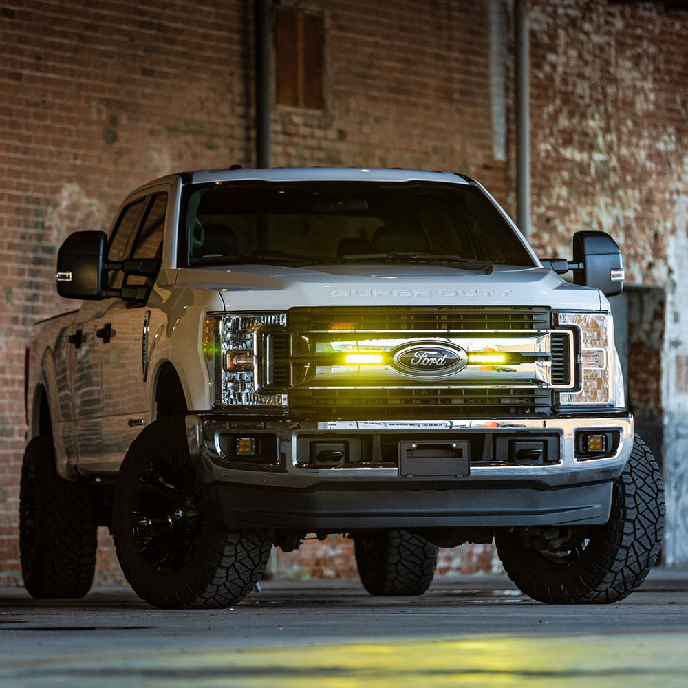 Rigid Industries 6" SR-Series SAE compliant fog light bar in black with yellow fog light, designed for off-road and vehicle lighting.