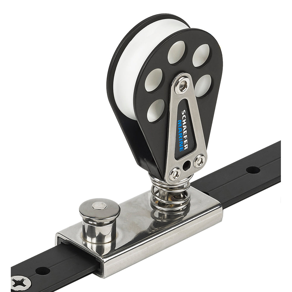 Schaefer Marine spring-loaded lined slide block for 1-inch T-Track, made of aluminum, used in boat rigging and marine applications.
