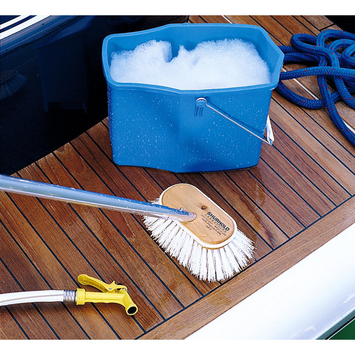 Shurhold 6-inch polypropylene stiff bristle deck brush for cleaning boats and surfaces, durable and effective for tough grime removal.
