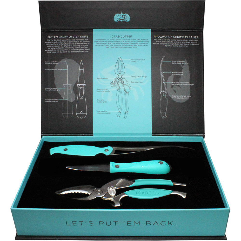 Toadfish Coastal Kitchen Collection accessories including oyster knife, shrimp cleaner, and crab cutter on a clean surface.